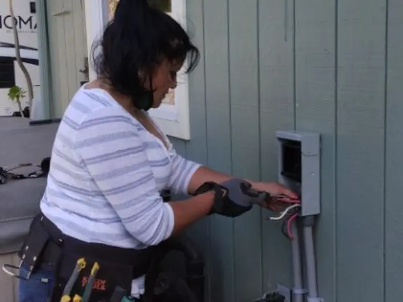 Licensed electrician wiring an exterior subpanel in Valdese