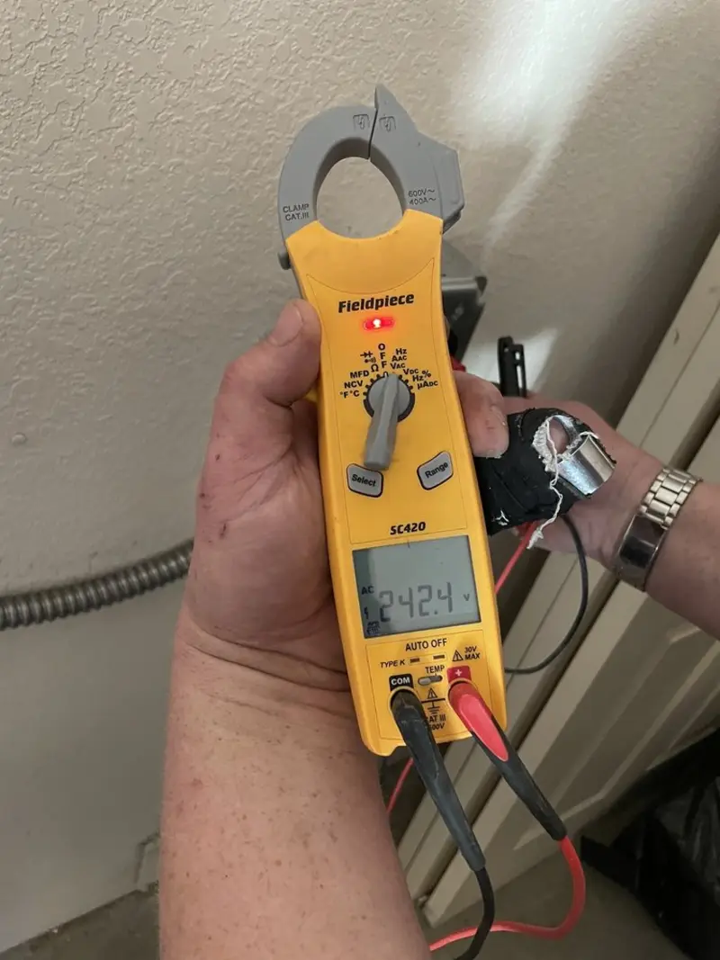 Voltage testing with clamp meter during Circuit Breaker Repair in Valdese
